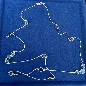 Nine West- Long blue faceted rhinestone silver tone necklace